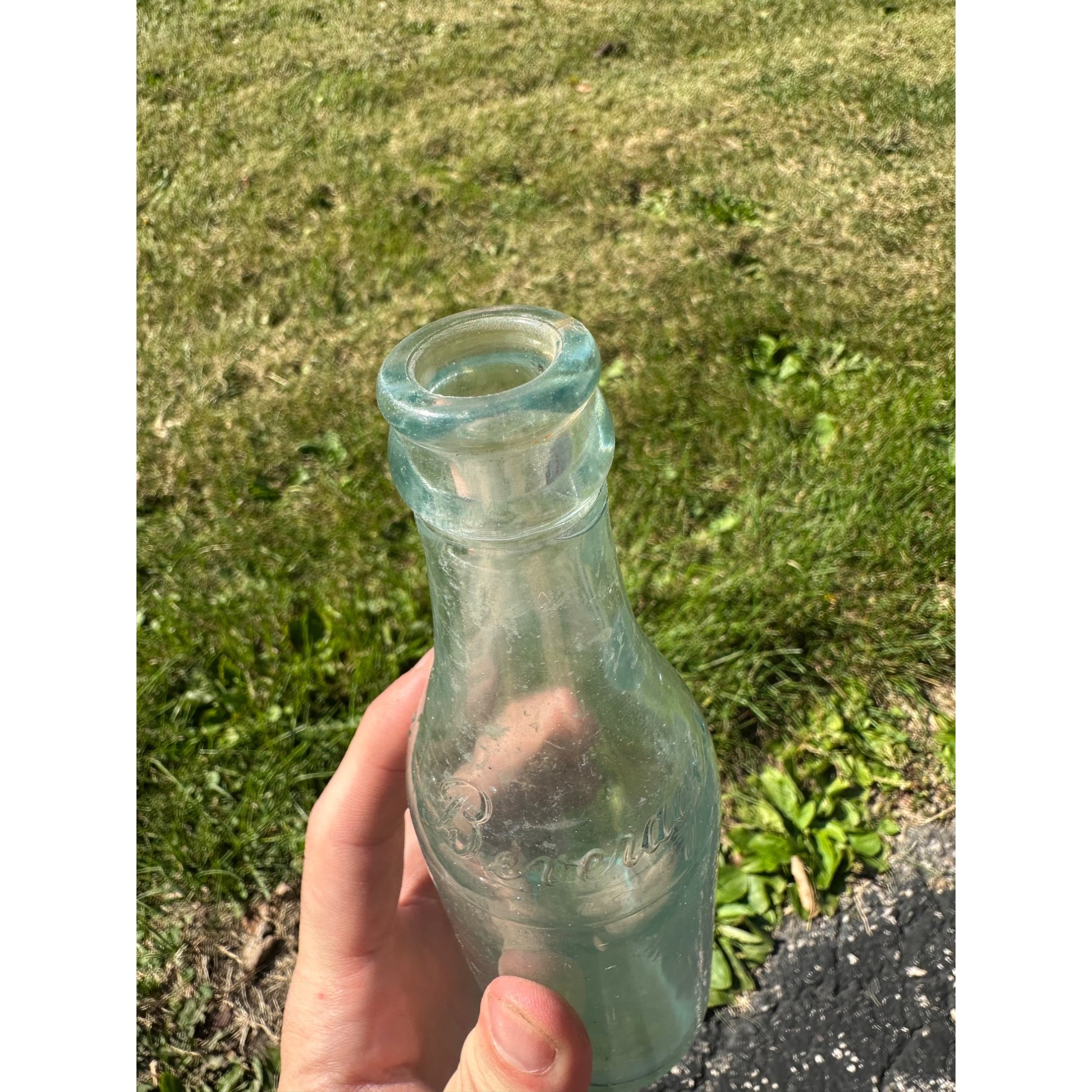 Vintage West Bend Beverages 7oz Embossed Soda Pop Bottle West Bend, Wisconsin