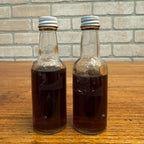 Vintage Novelty Bottles Daniel Booze Kentucky Feud Oil & Overcoat Par Beverage