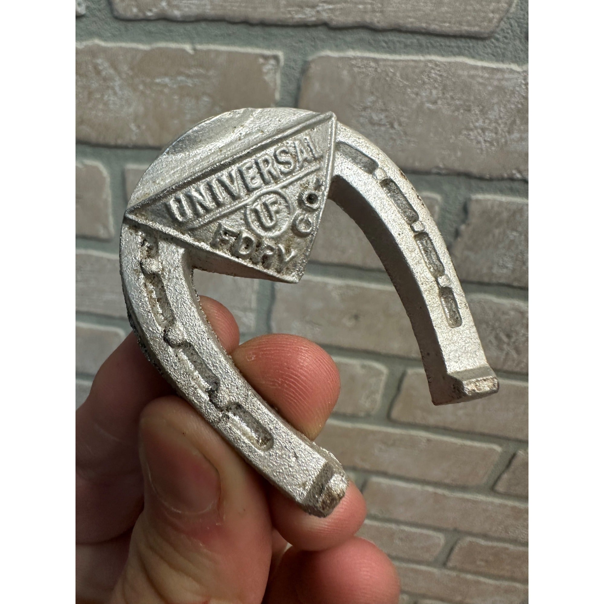 Vintage Advertising Cast Aluminum Horseshoe Universal Foundry Co Oshkosh WI