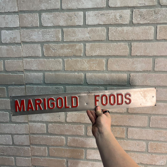 Vintage Marigold Foods Embossed Aluminum Advertising Strip Sign Dairy Wisconsin