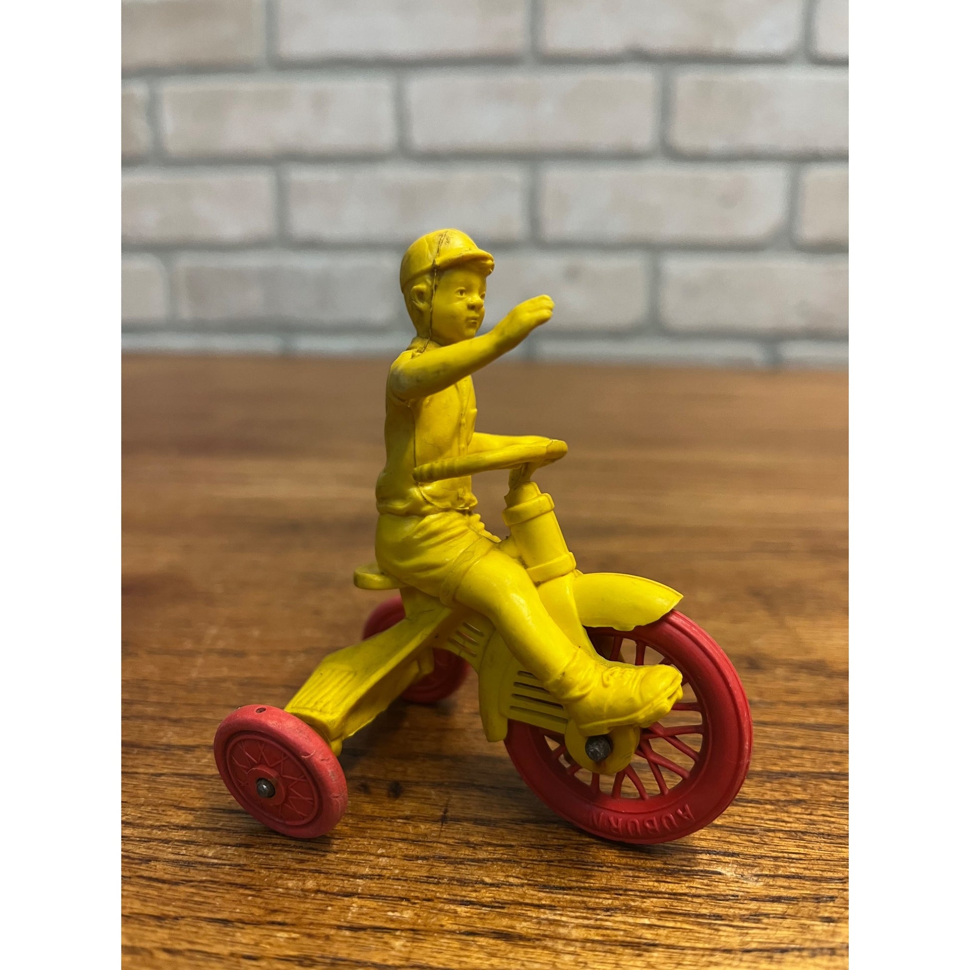 Vintage 1950s Auburn Rubber Co. Boy on Tricycle Toy Yellow Red 3"