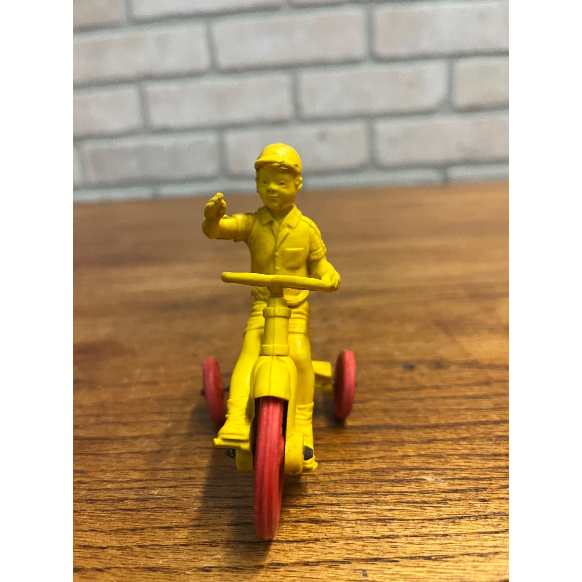 Vintage 1950s Auburn Rubber Co. Boy on Tricycle Toy Yellow Red 3"