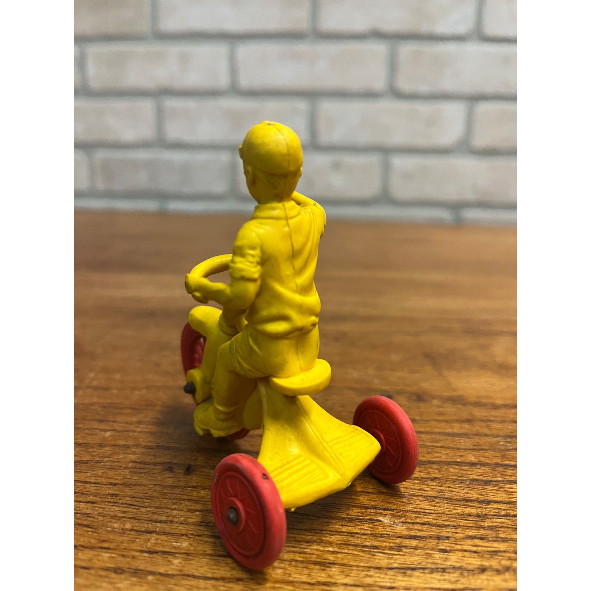 Vintage 1950s Auburn Rubber Co. Boy on Tricycle Toy Yellow Red 3"