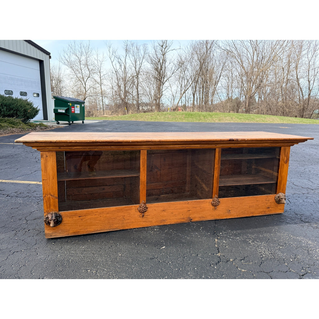 Antique 8ft General Store Display Counter Cabinet w/ Glass, Dog Head & Grape Carvings – c.1900