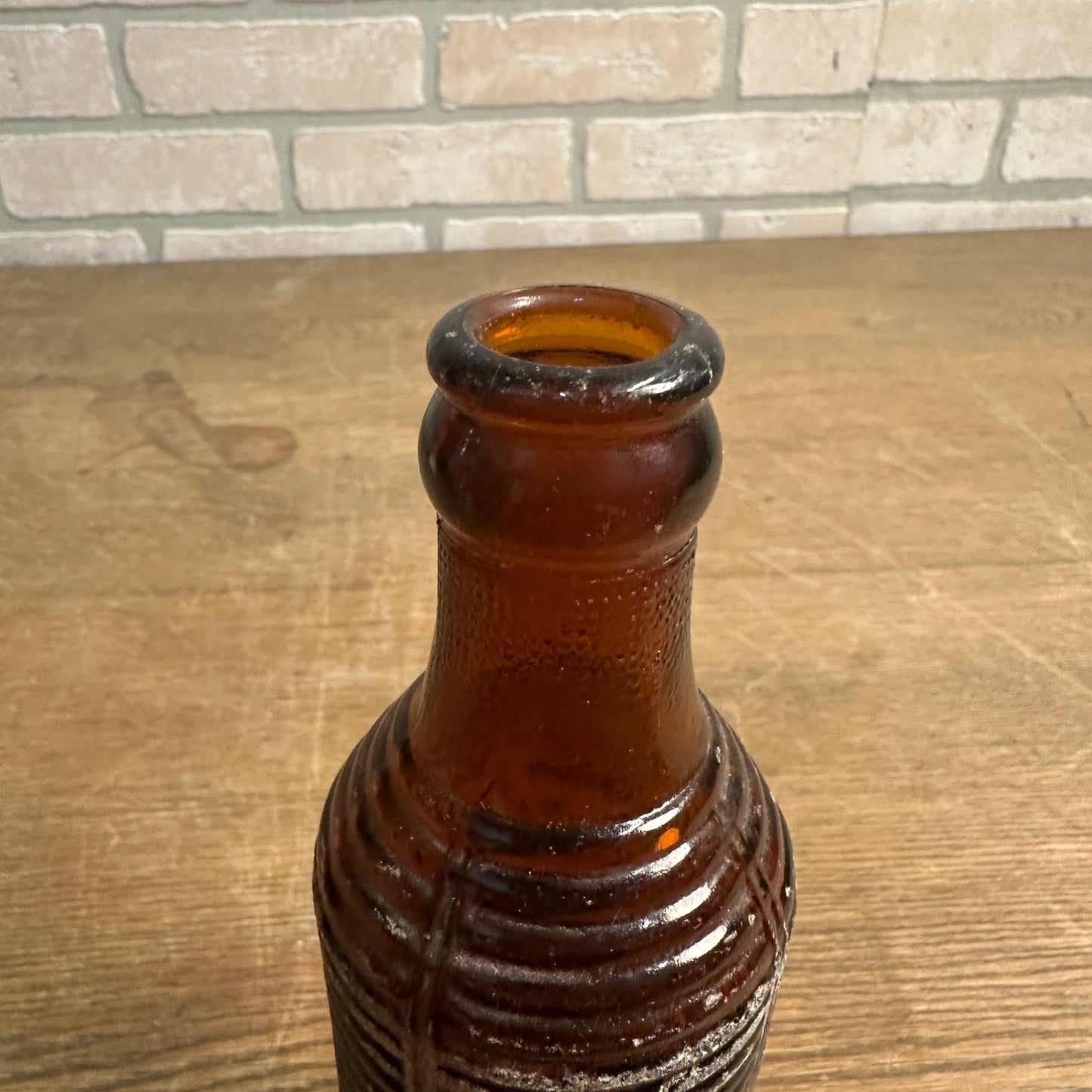 1951  7oz ORANGE CRUSH ACL AMBER SODA BOTTLE M. & S. BOTTLING CLINTON, IOWA