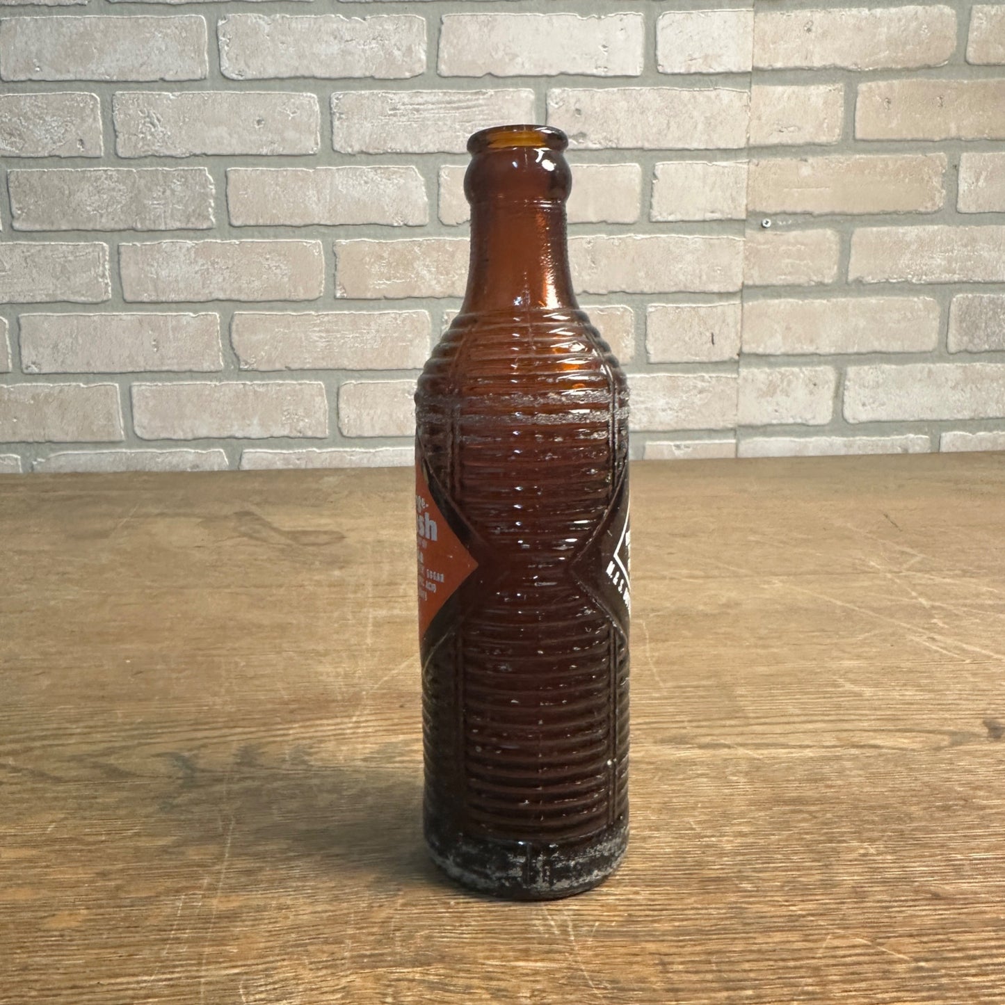 1951  7oz ORANGE CRUSH ACL AMBER SODA BOTTLE M. & S. BOTTLING CLINTON, IOWA