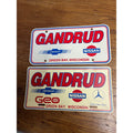 Vintage Gandrud Chevy Nissan Benz Green Bay WI Dealership Booster License Plate