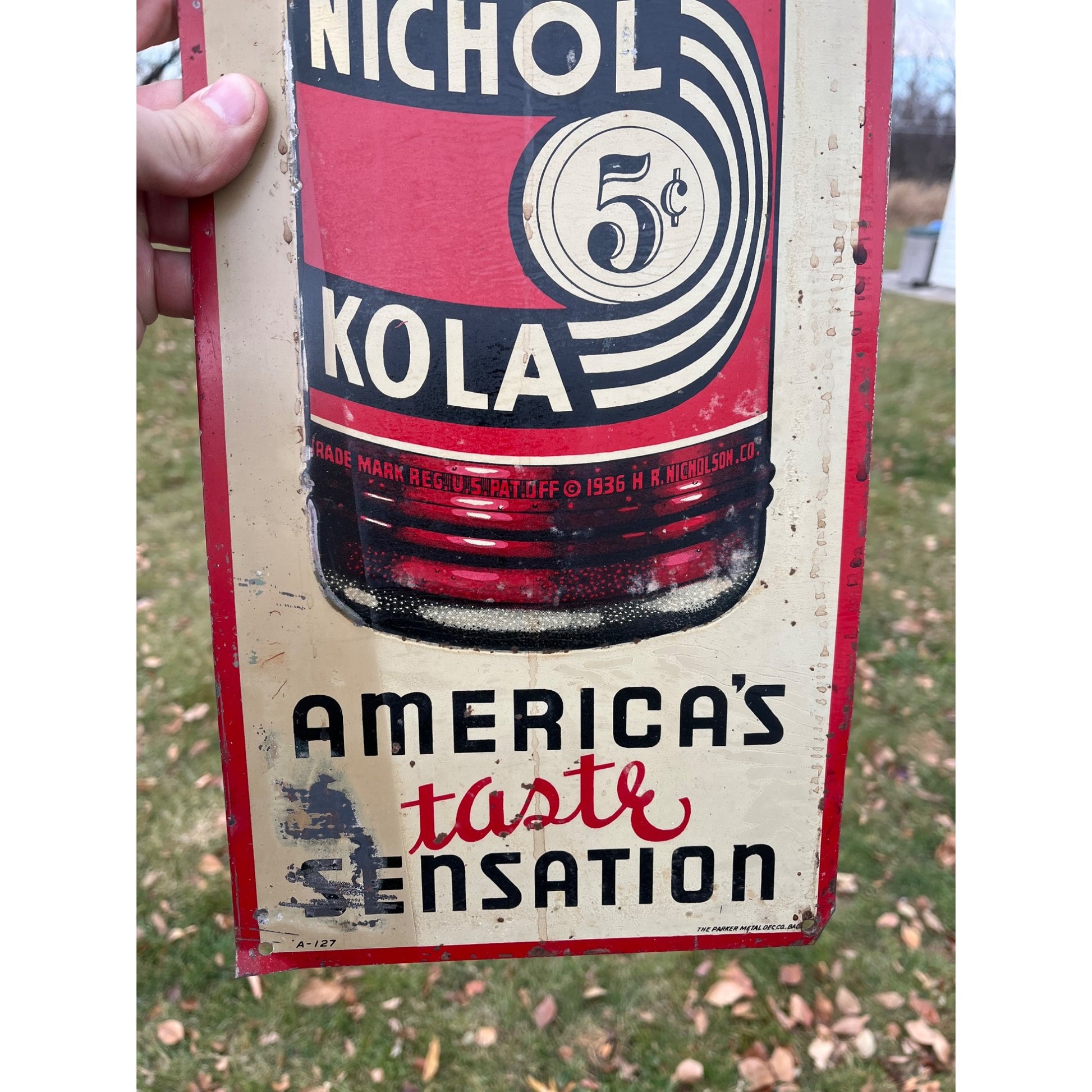 Nichol Kola Embossed Painted Metal Sign Vertical With Bottle 24x8 Inches