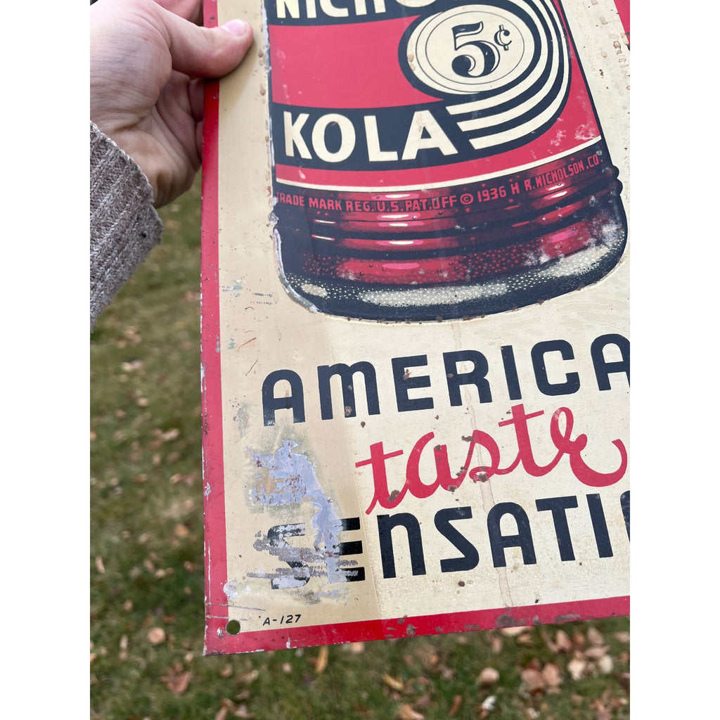 Nichol Kola Embossed Painted Metal Sign Vertical With Bottle 24x8 Inches