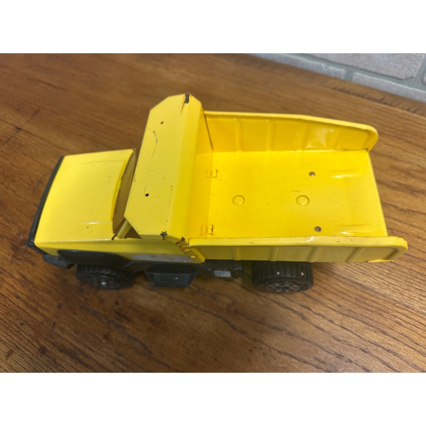 Vintage Tonka 13.5" Yellow Toy Dump Truck Pressed Steel Toy Plastic Tires