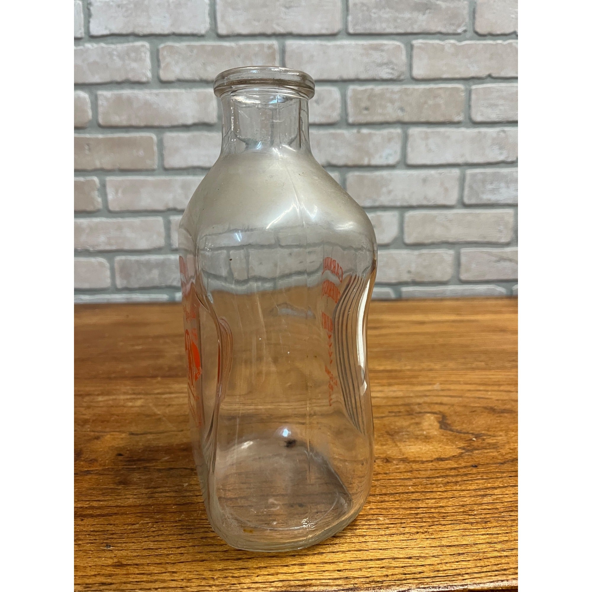 Carnival Guernsey Dairy  Quart Store Milk Bottle - Algoma, Wis Wi