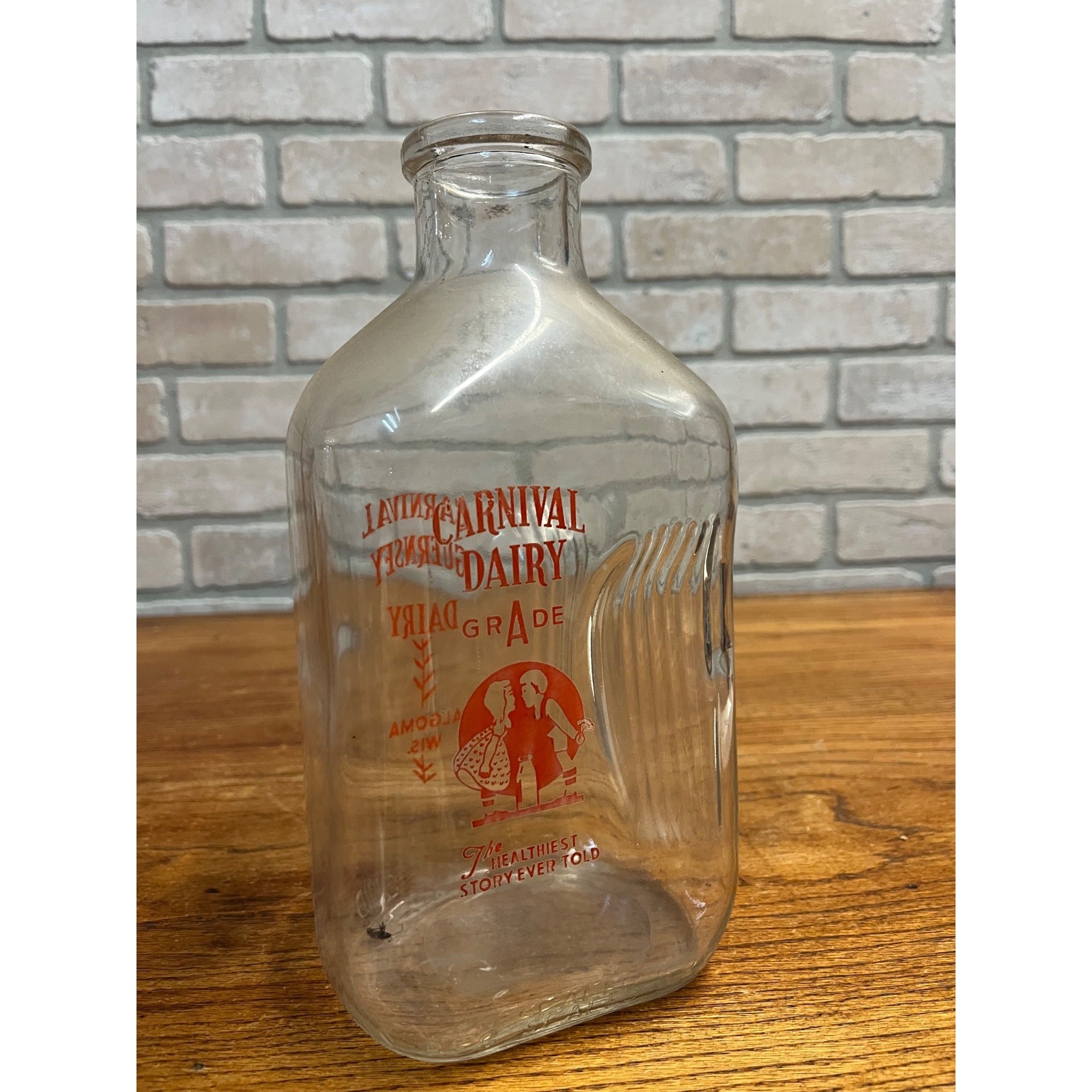 Carnival Guernsey Dairy  Quart Store Milk Bottle - Algoma, Wis Wi