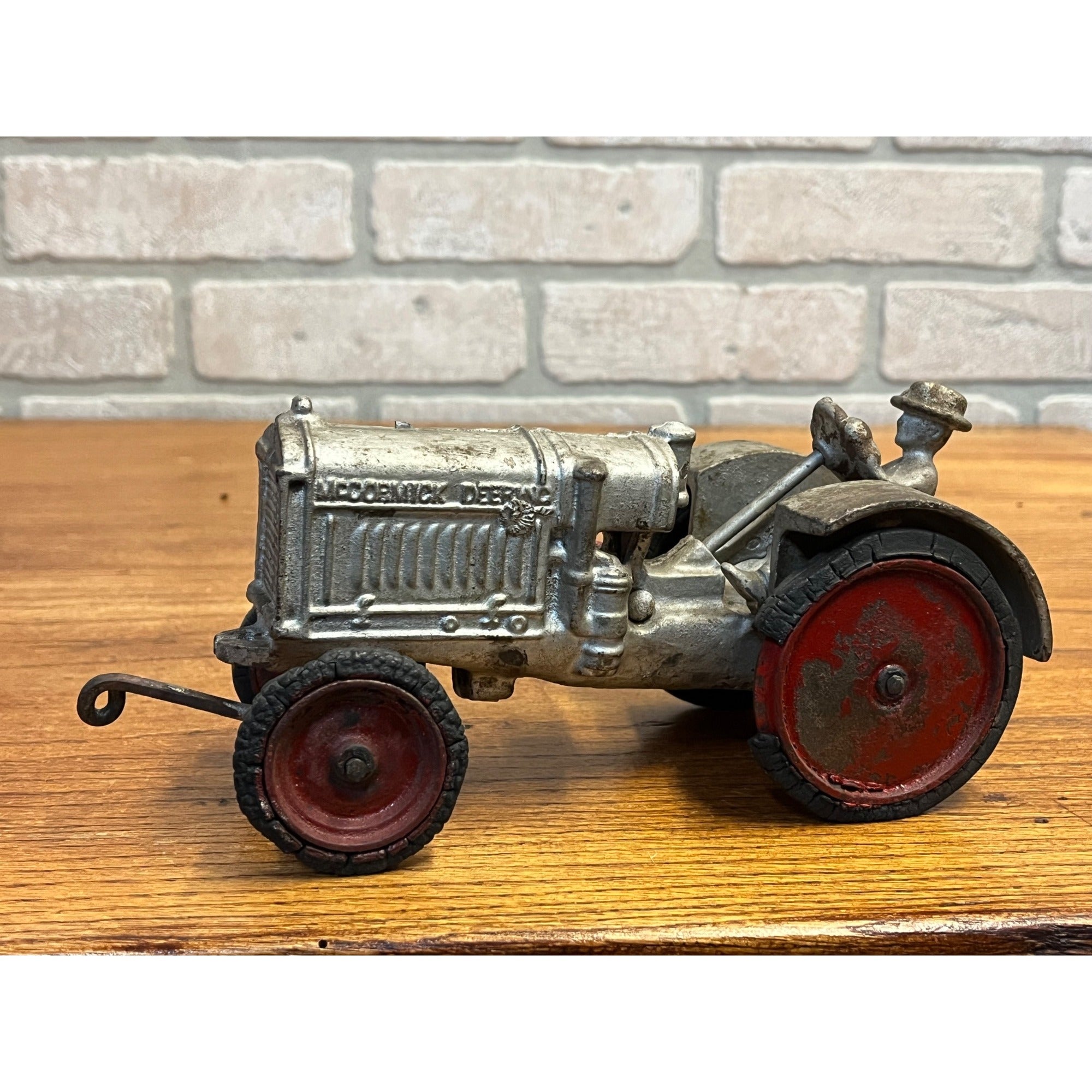 Vintage Arcade McCormick Deering Cast Iron Toy Tractor with Driver