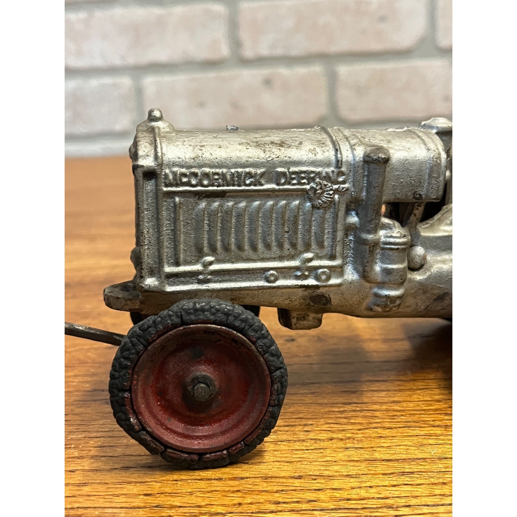 Vintage Arcade McCormick Deering Cast Iron Toy Tractor with Driver