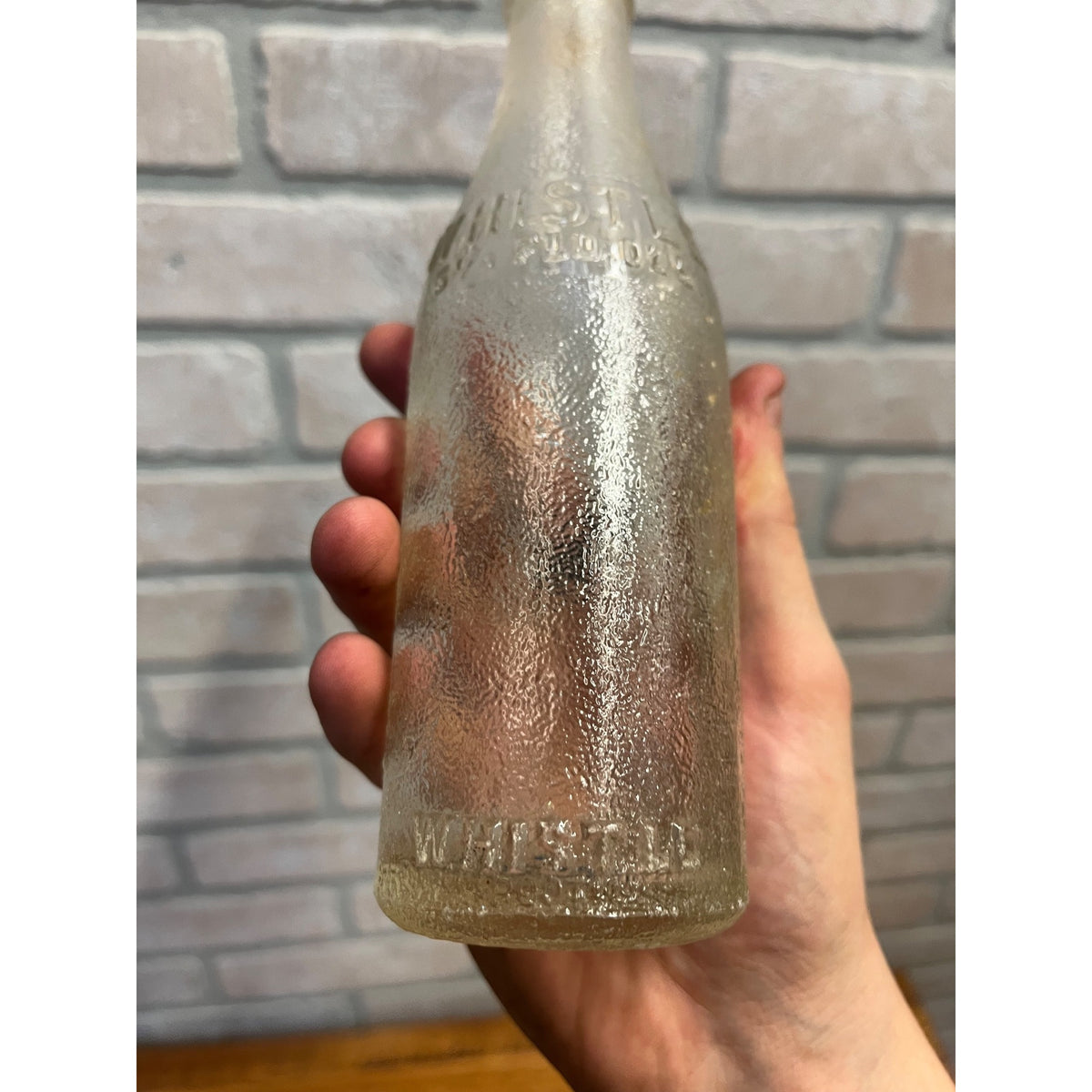 Vintage 6-1/2 oz Embossed Whistle Soda Bottle Beloit Wis