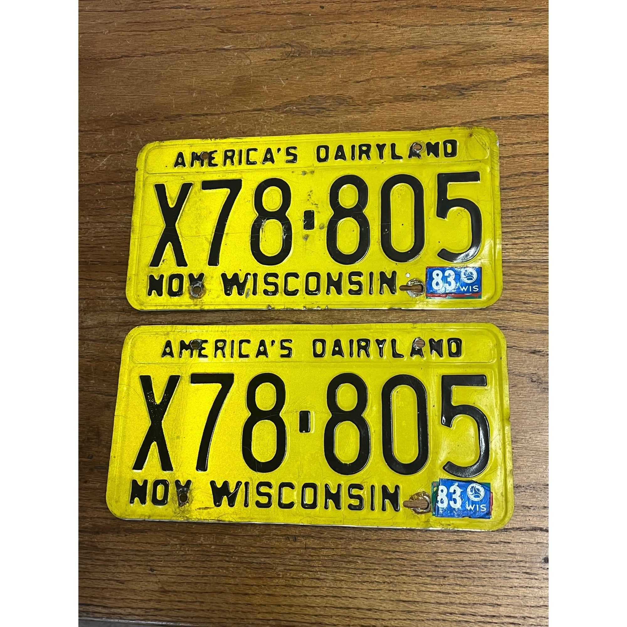 Vintage 1983 Wisconsin Yellow Black Embossed Metal License Plates Dairyland Pair