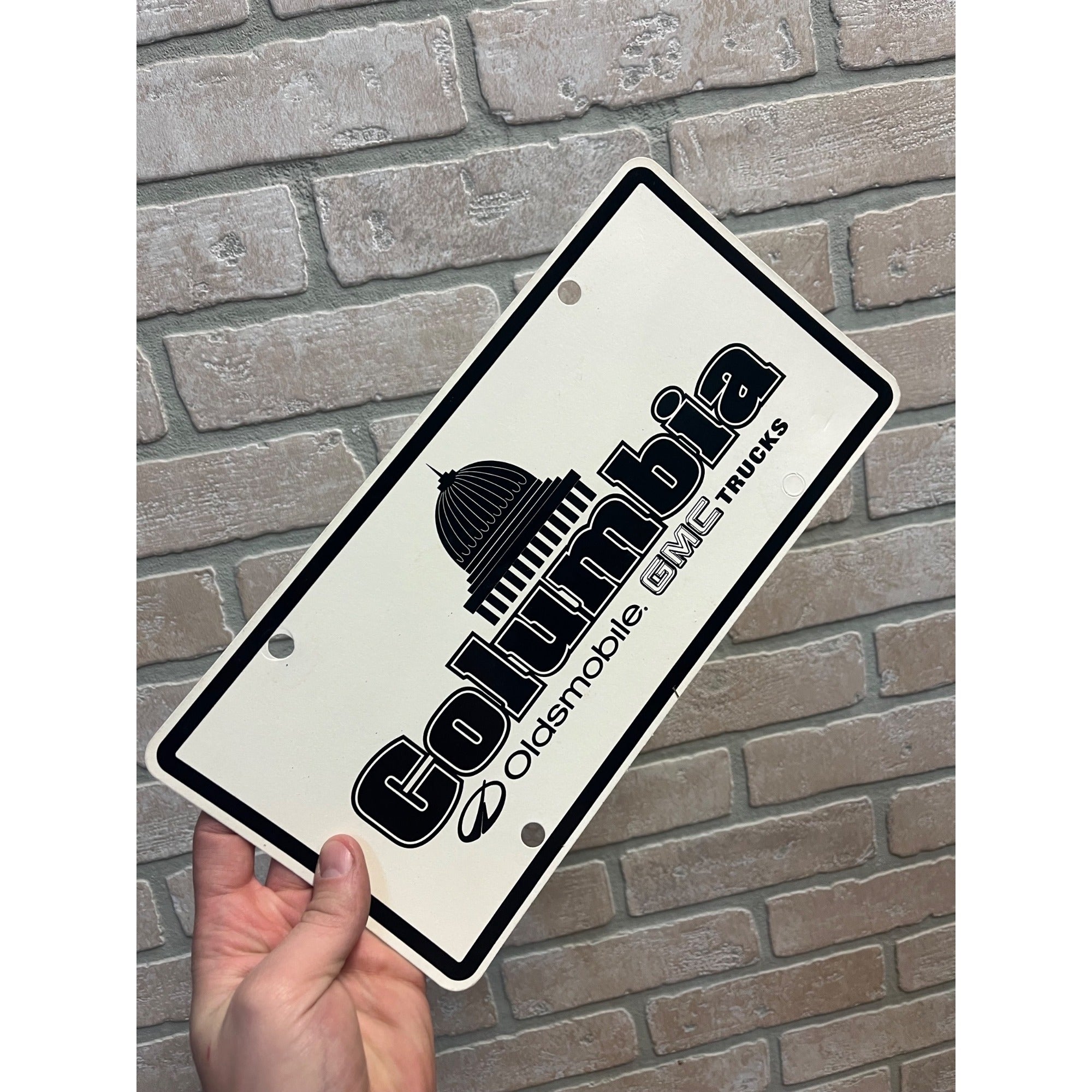 Vintage Columbia Oldsmobile GMC Trucks Dealership Booster License Plate