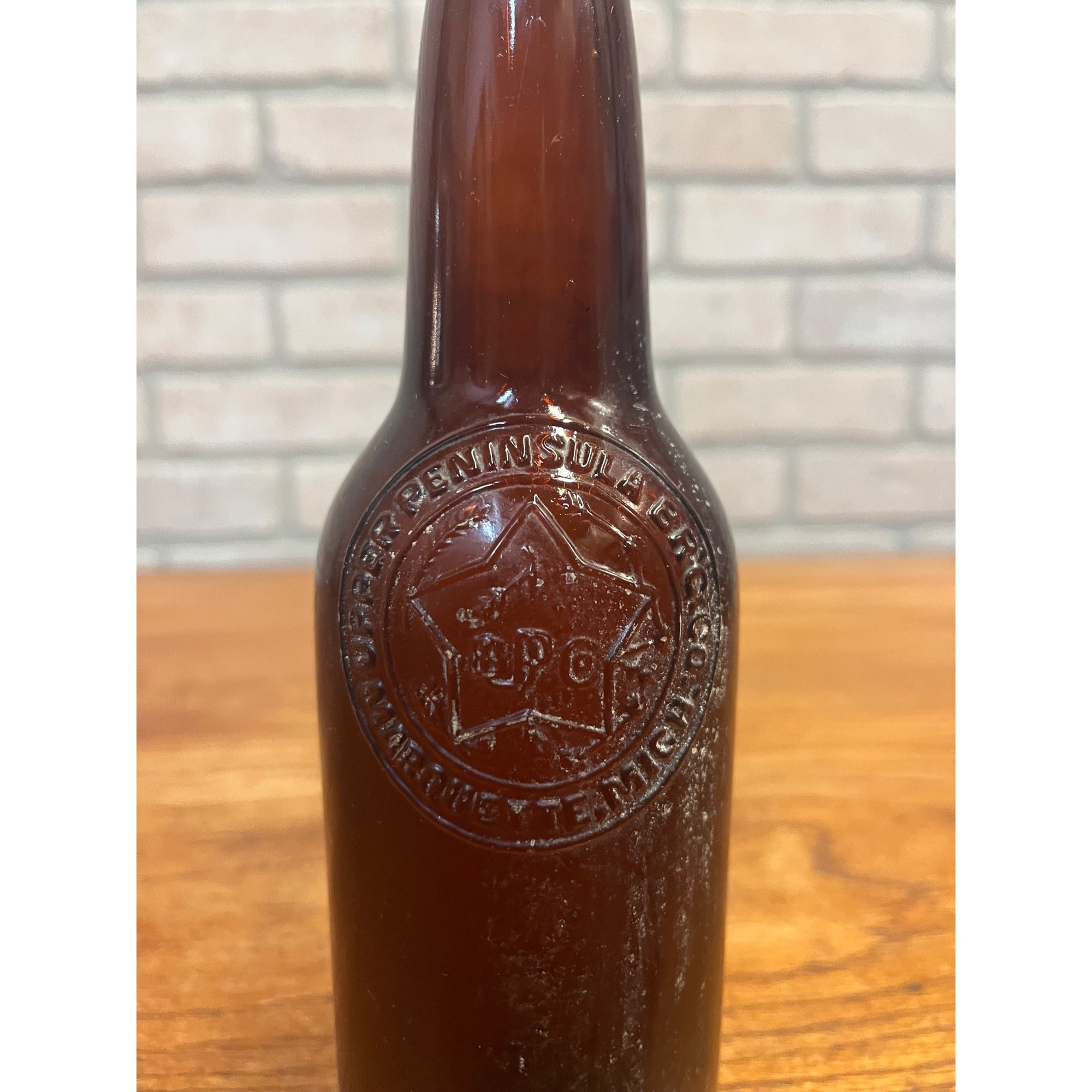 Vintage Upper Peninsula Brewing Co Marquette MI Beer Bottle Amber Embossed