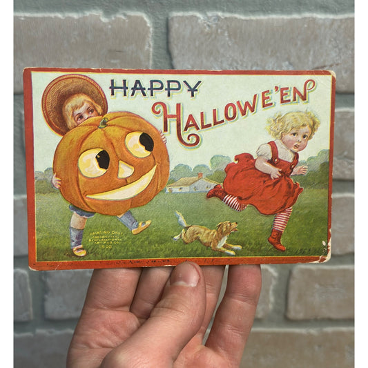 Happy Halloween 1908 Boy Hat Pumpkin Chasing Girl Red Dress Shoes Dog Postcard