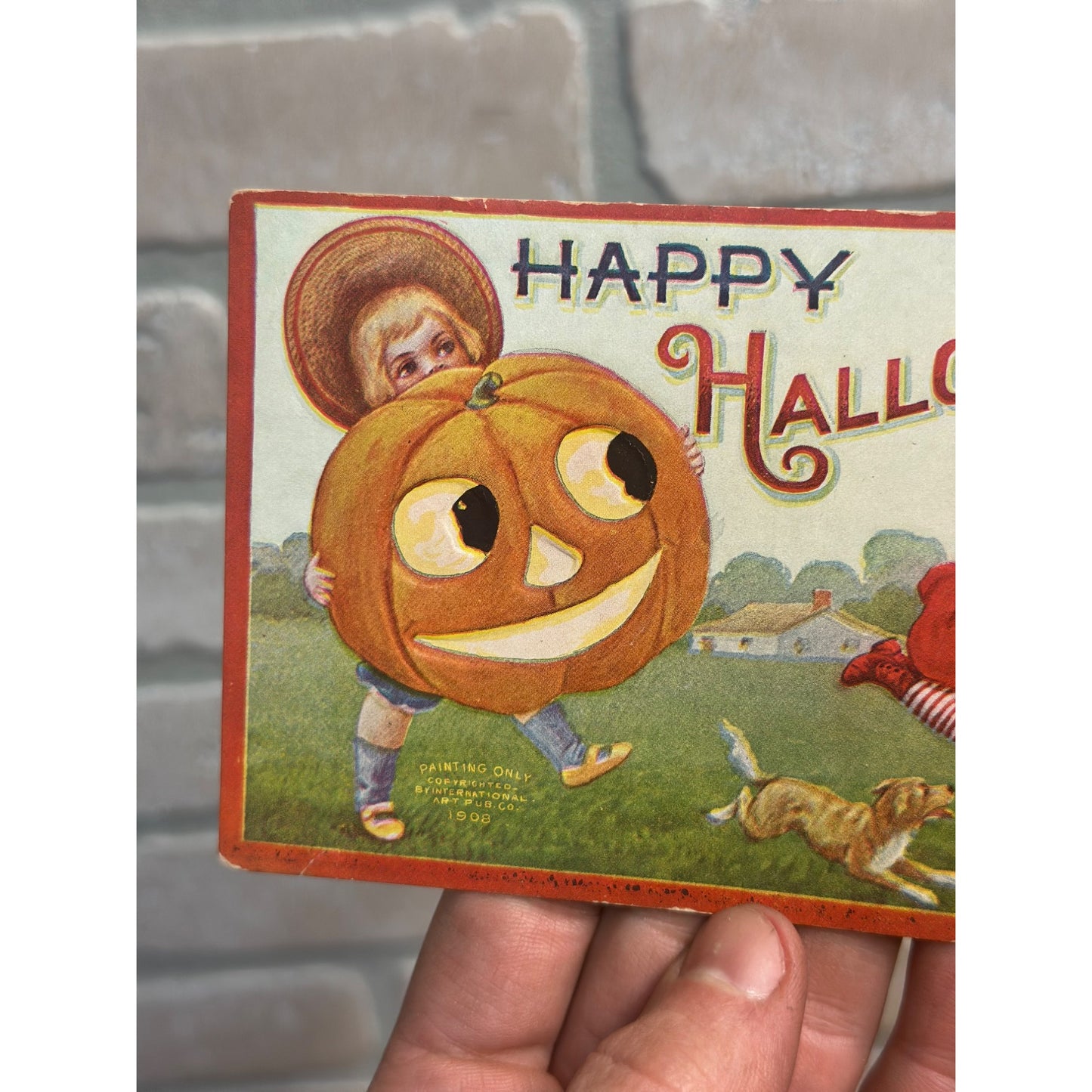 Happy Halloween 1908 Boy Hat Pumpkin Chasing Girl Red Dress Shoes Dog Postcard