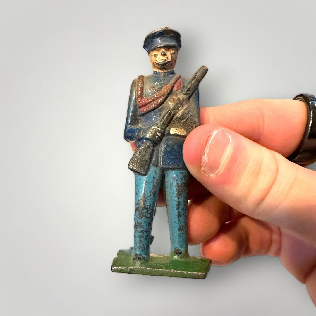 OLD TOY GREY IRON CAST IRON MARCHING MILITARY SOLDIER BLUE UNIFORM PARADE