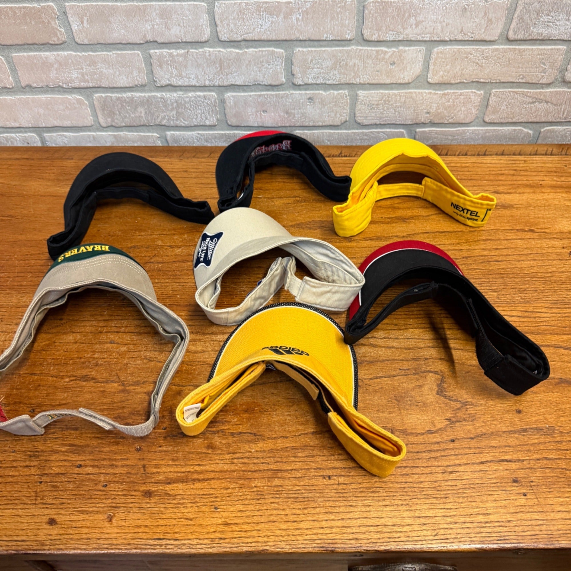 Lot Of 7 Vintage Logo Visors Featuring Bacardi Miller Genuine Draft NASCAR Adidas Bandits