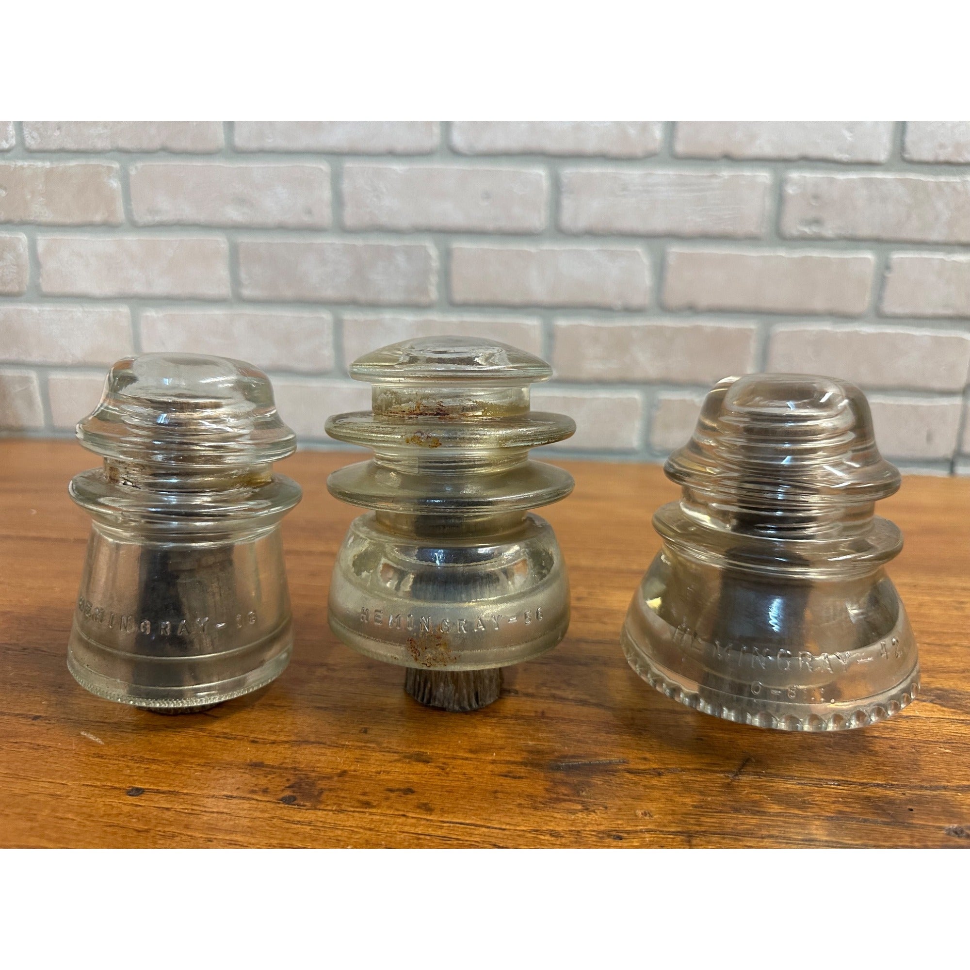 Antique Lot (3) Clear Glass Hemingray Insulators on Wood Pegs 16, 56, 42