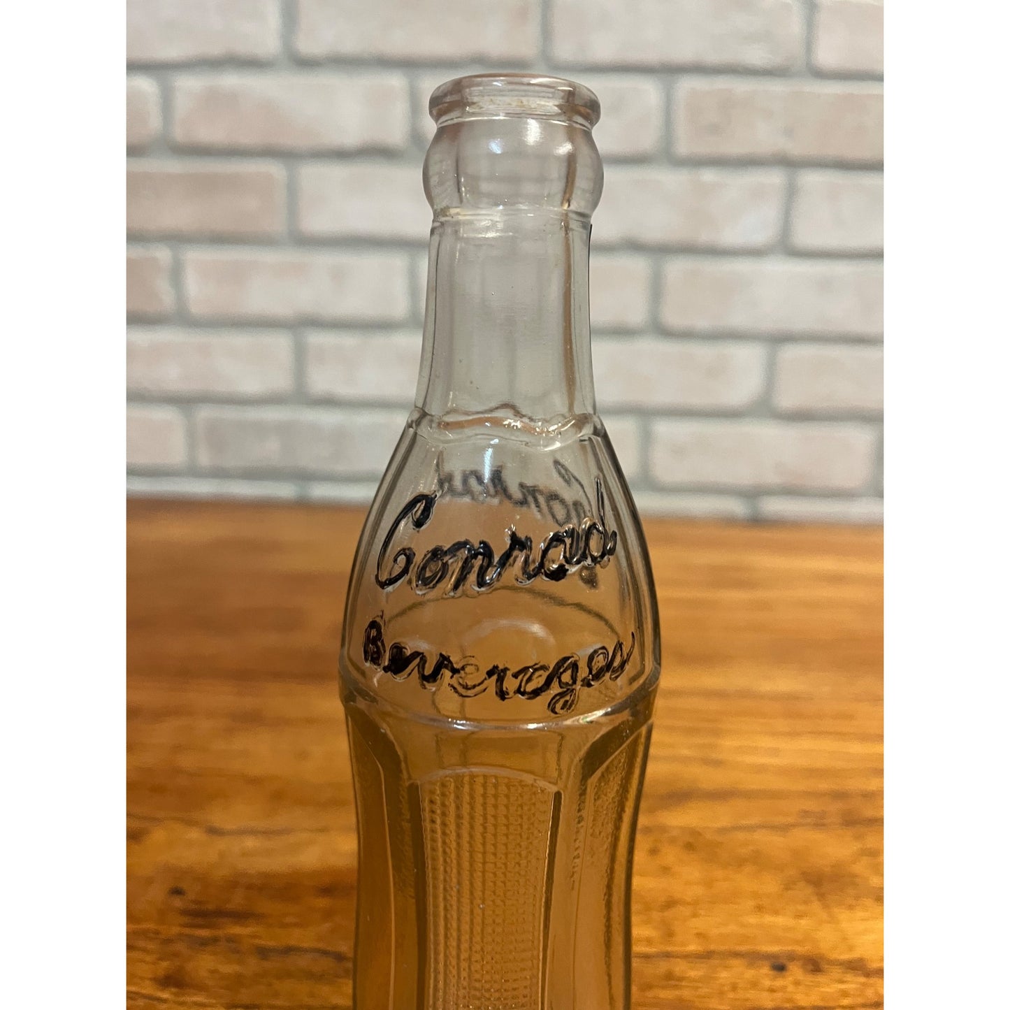 Embossed CONRAD BEVERAGES OCONOMOWOC WISCONSIN WIS WI Fancy Deco Soda Bottle