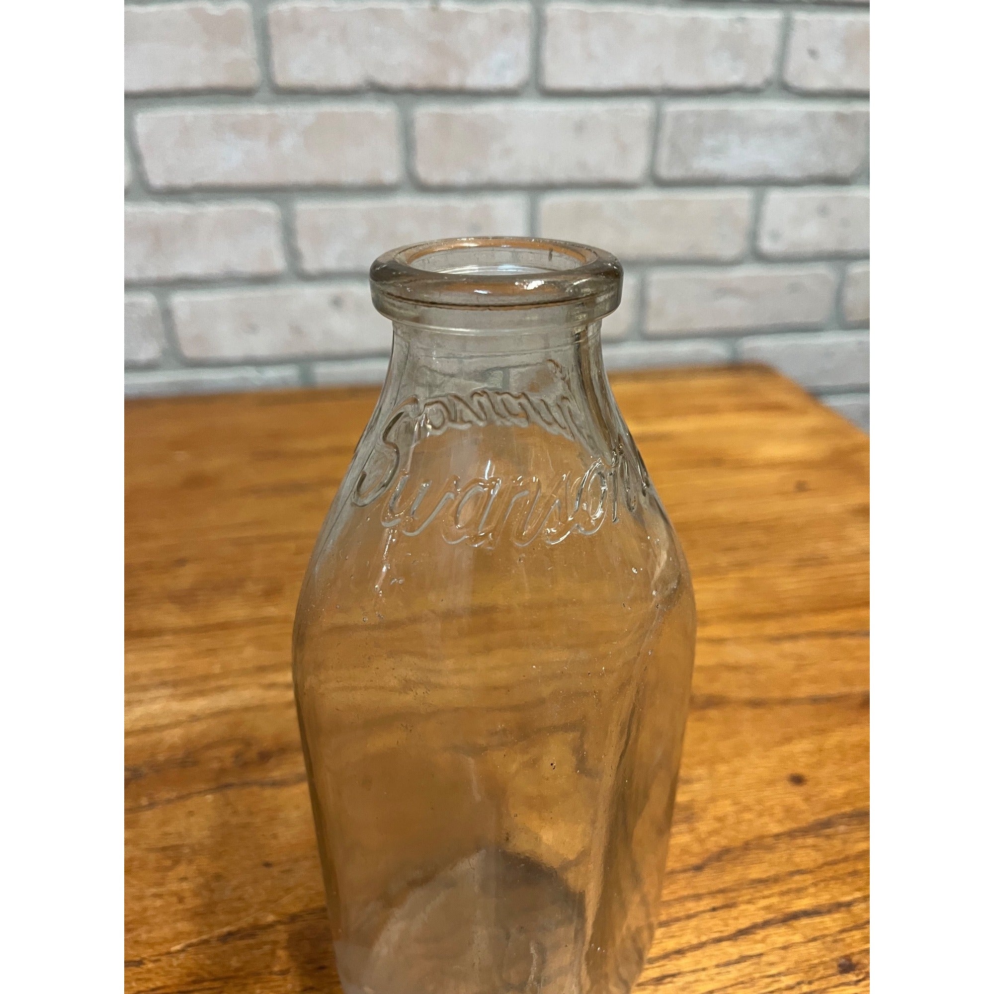 1948 Swanson's Dairy of Silvis Il Embossed Quart Milk Bottle Rock Island County