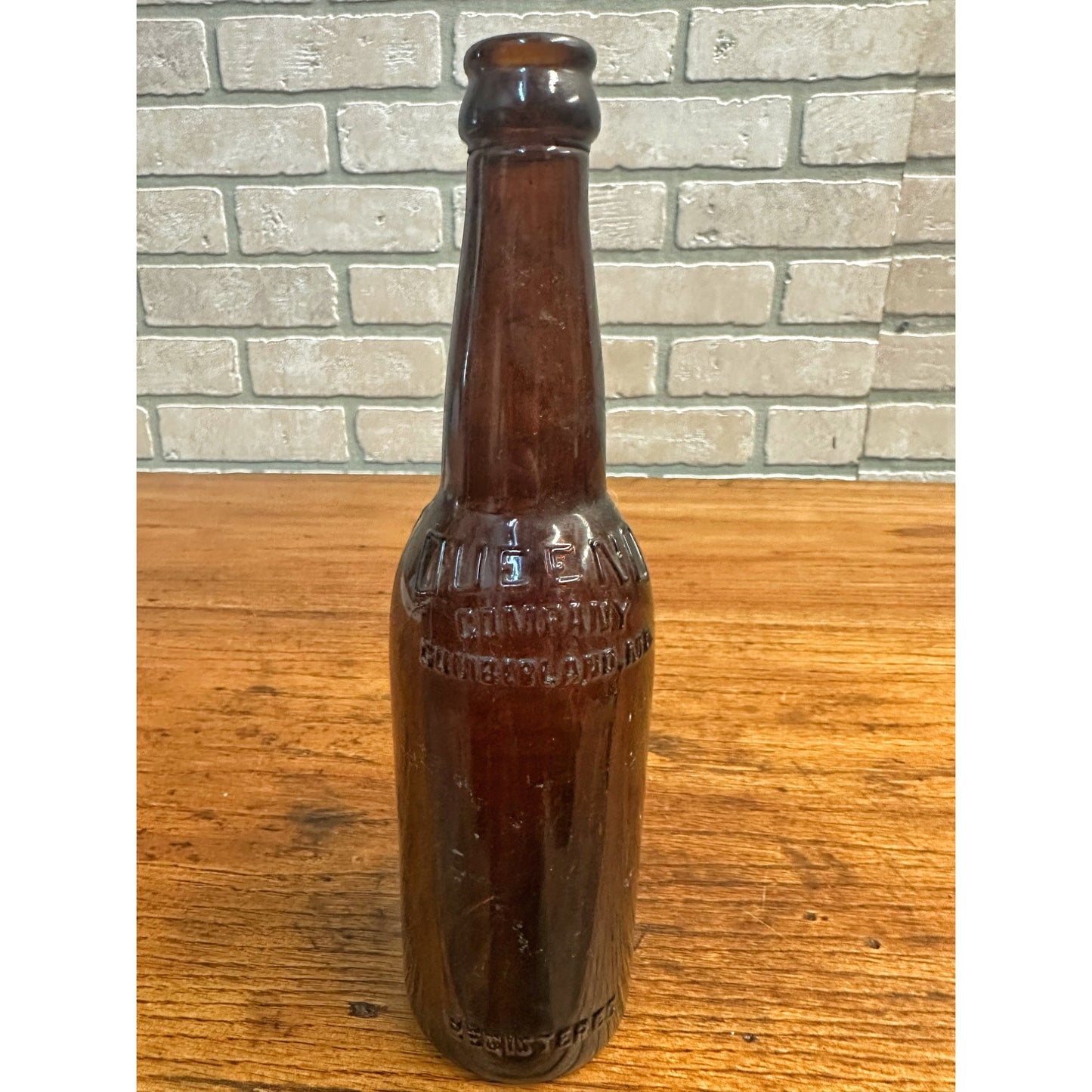 Queeno Brewing Co Cumberland MD Amber Brown Beer Bottle 12oz Embossed