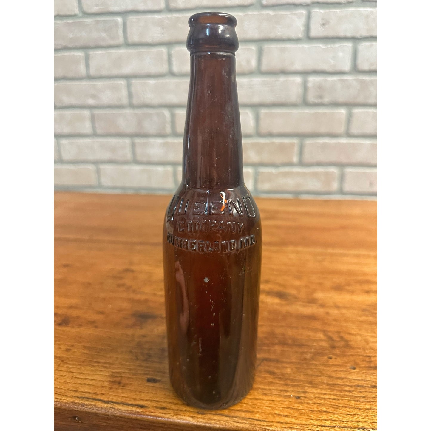 Queeno Brewing Co Cumberland MD Amber Brown Beer Bottle 12oz Embossed