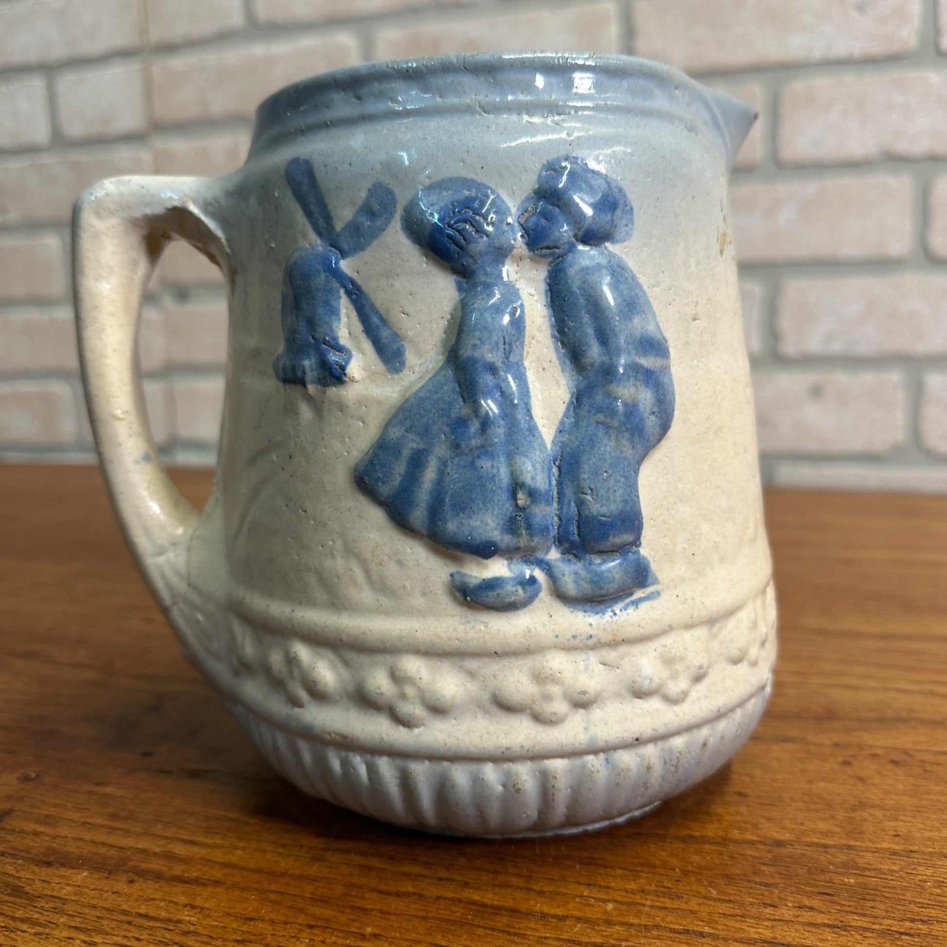 Antique 1916 Brush-McCoy Stoneware Pitcher with Kissing Dutch Children/Windmill