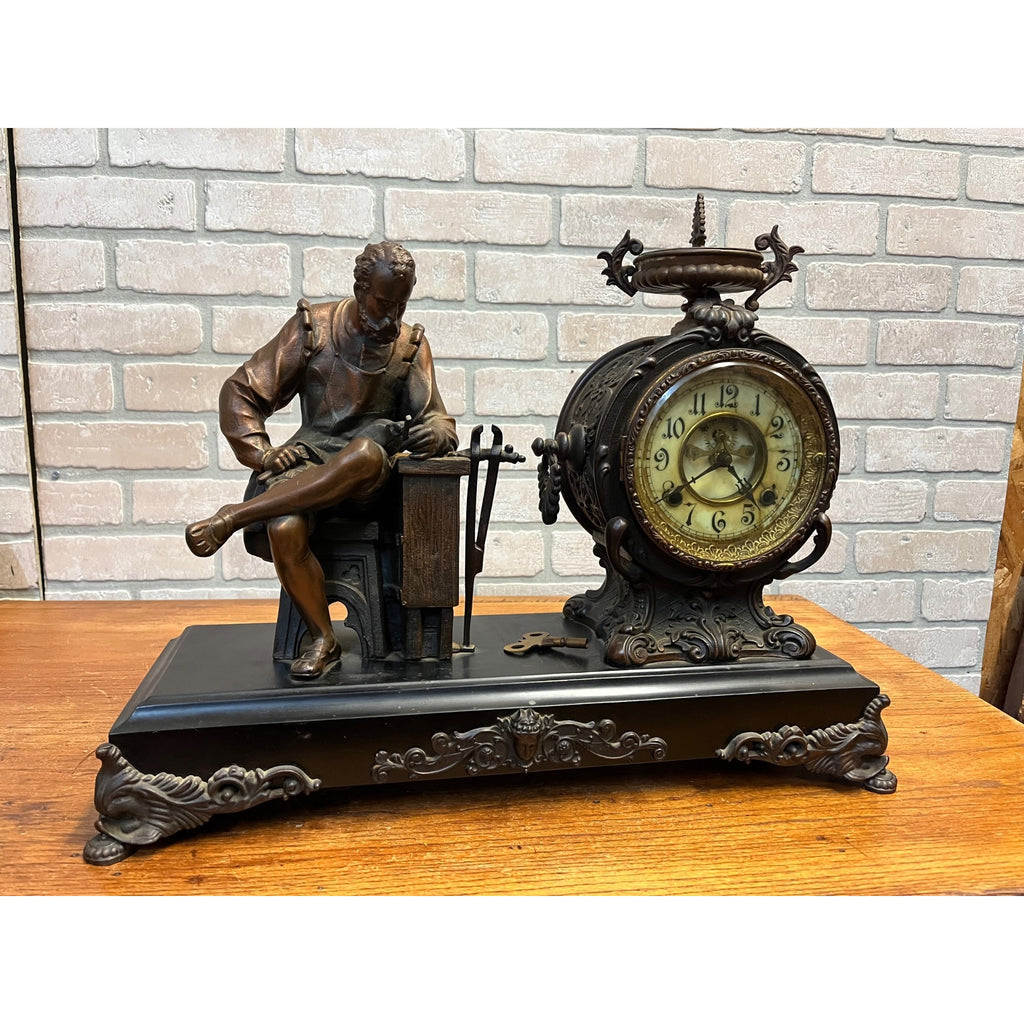 Antique New Haven Bronze Figural Mantle Clock Silversmith Shoemaker 8 Day Time & Strike Gong Clock