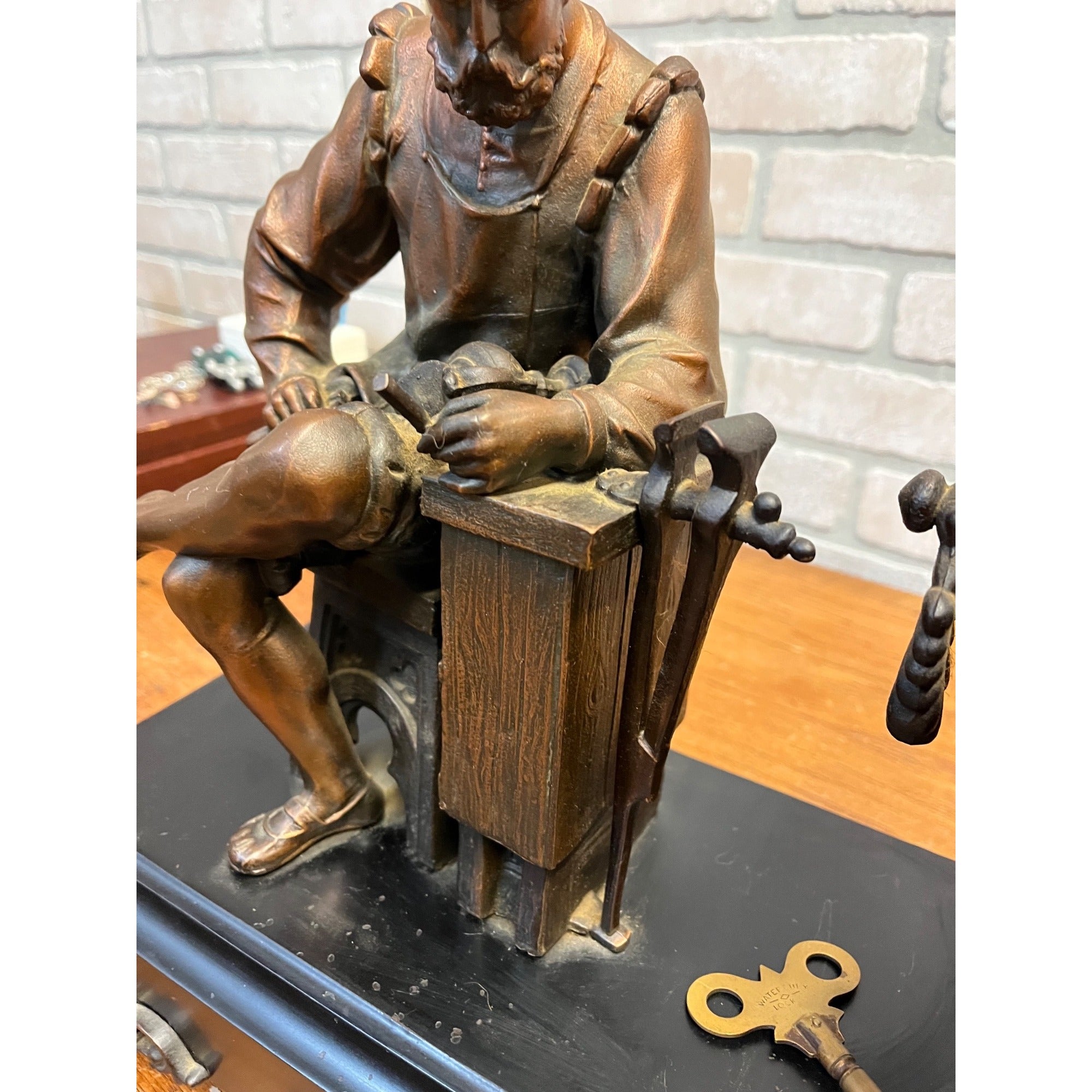 Antique New Haven Bronze Figural Mantle Clock Silversmith Shoemaker 8 Day Time & Strike Gong Clock