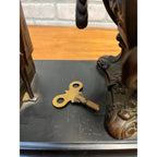 Antique New Haven Bronze Figural Mantle Clock Silversmith Shoemaker 8 Day Time & Strike Gong Clock
