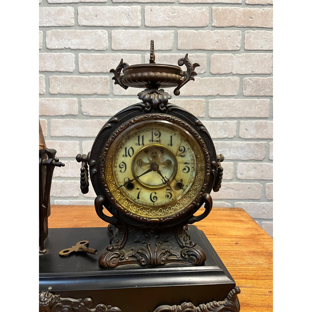 Antique New Haven Bronze Figural Mantle Clock Silversmith Shoemaker 8 Day Time & Strike Gong Clock