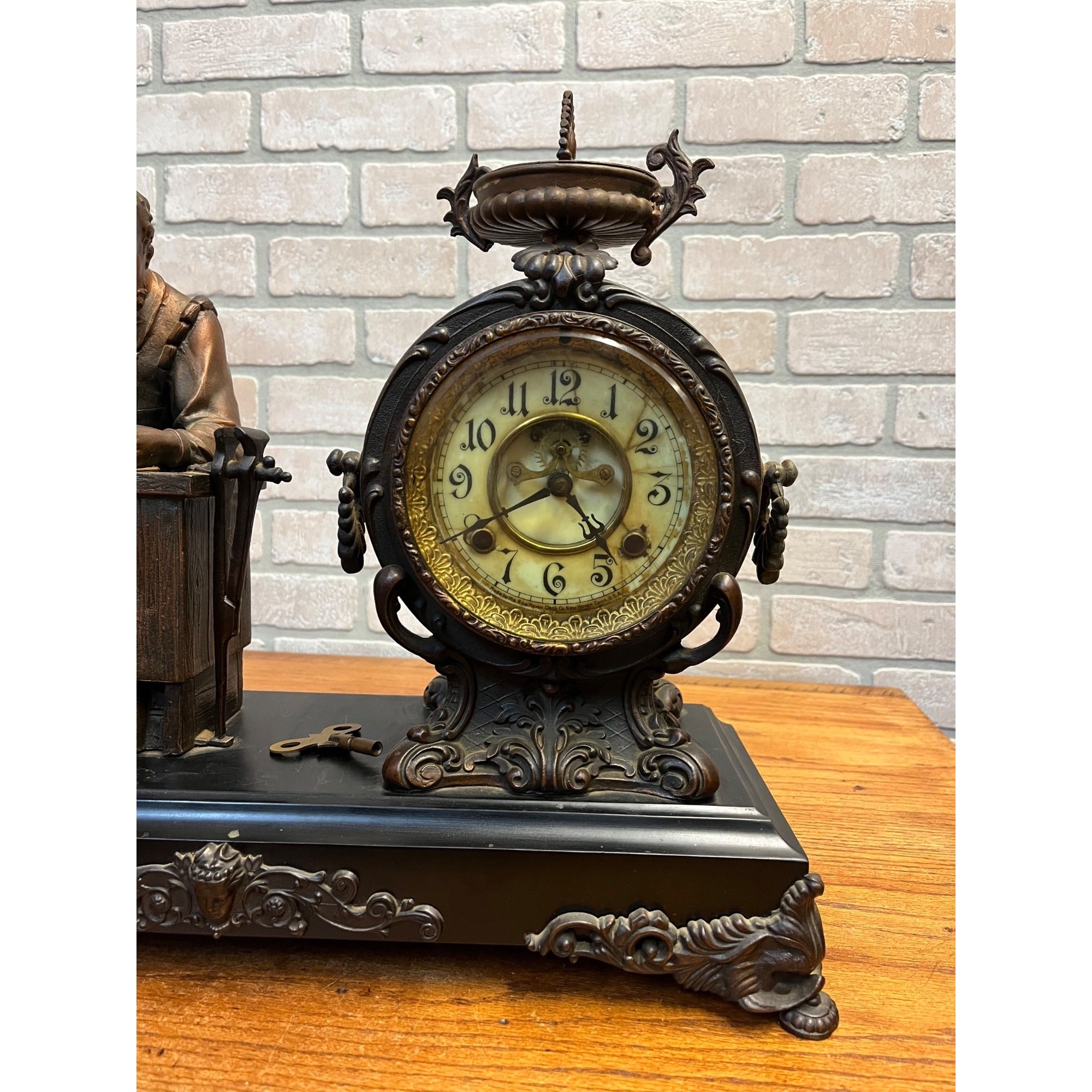 Antique New Haven Bronze Figural Mantle Clock Silversmith Shoemaker 8 Day Time & Strike Gong Clock